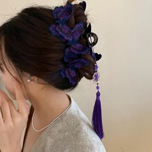Close-up detail of Neo-Chinese style purple embroidered butterfly hair claw clip with tassel
