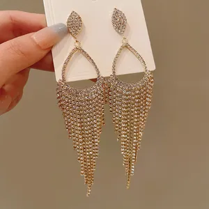 Close-up detail showing the elegant silver needle rhinestone waterdrop tassel earrings