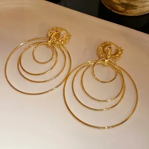 Elegant gold-plated multi-layer hoop earrings with tiny rhinestone-encrusted clasps.