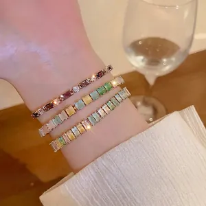 Elegant colorful rectangular zircon adjustable bracelets displayed on a female wrist.