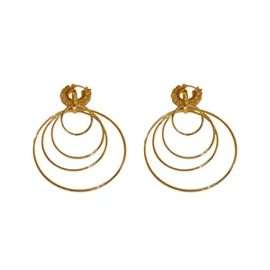 Elegant multi-layer gold hoop earrings with sparkling rhinestone details in vintage style