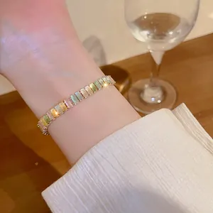 Elegant macro detail of colorful baguette cut zircon adjustable bracelet on lady's wrist