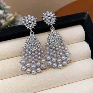Elegant silver needle tassel pearl earrings with sparkling diamond-encrusted detail