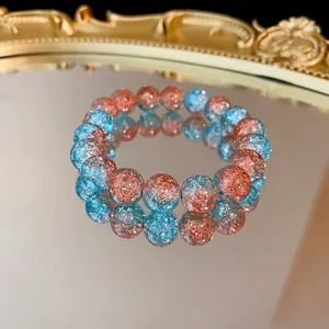 Bracciale elastico fatto a mano con perline in vetro craquelé sfumato blu e arancio