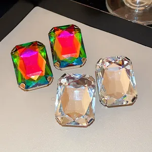 Macro view of French retro oversized rectangular crystal stud earrings in vibrant colors