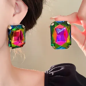 Macro view of French vintage oversized colorful rectangular crystal earrings for women