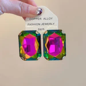 Close-up of oversized rectangular rainbow crystal earrings with S925 silver posts.