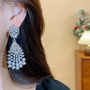 Macro view of high-end vintage tassel earrings featuring white pearls and shimmering crystals