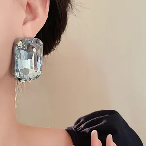 Close-up view of a French vintage exaggerated rectangular light blue crystal earring