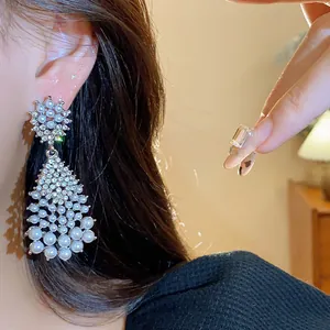 Detailed macro shot of vintage-style tassel pearl earrings with sparkling rhinestones