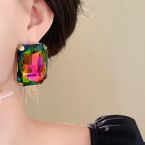 Close-up of oversized rectangular rainbow crystal earring in vintage French style
