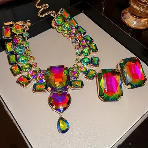 Detailed view of vintage jewelry set featuring rainbow crystals and large heart pendant