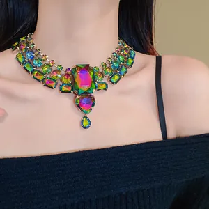 Close-up of a vintage colorful rhinestone choker with heart and teardrop pendants.