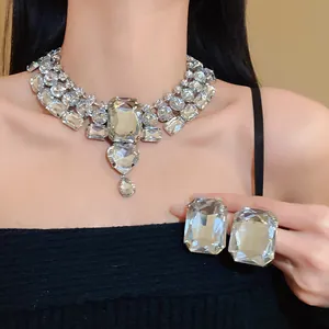 Detailed view of chunky rhinestone heart teardrop necklace and matching earrings set