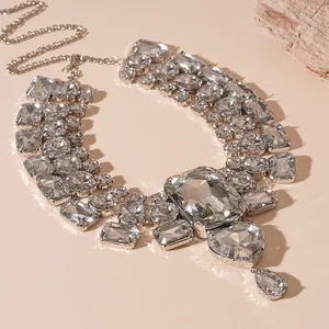 Exaggerated vintage style necklace featuring large heart and teardrop rhinestones