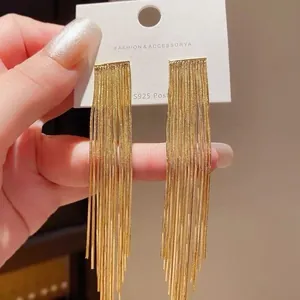 Long elegant gold tassel drop earrings with S925 silver needles for a stylish look.