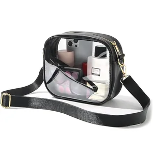 Transparent PVC crossbody bag with black trim and gold hardware for travel makeup storage