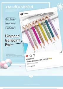 Set of luxury rhinestone-studded ballpoint pens with a large crystal diamond topper.