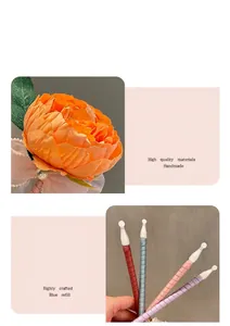 Close-up detail of creative handmade flower pens with silk ribbon barrels and blue ink refills