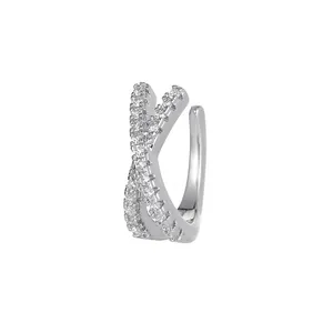 Detailed view of a silver-toned cross ear cuff featuring sparkling micro-pave zircon stones