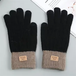 Top view of black and taupe knitted touchscreen gloves with imitation alpaca wool texture.