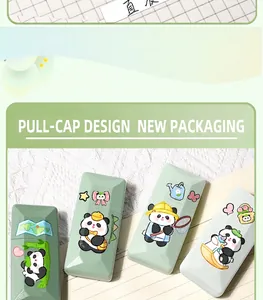 Close-up of four cute panda correction tapes with pull-cap design in shades of green