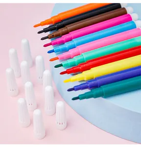 Close-up detail of vibrant mini washable watercolor pens with white caps for kids art