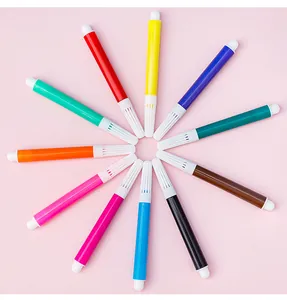 12-color mini watercolor pens arranged in a creative sunburst pattern on pink background