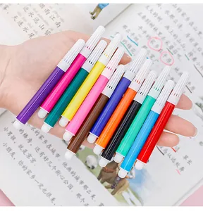 Close-up of 12-color mini washable watercolor pens held in a hand for kids' art.