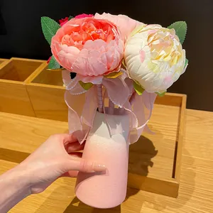 Elegant artificial peony flower pens bouquet in a pink gradient ceramic vase gift.