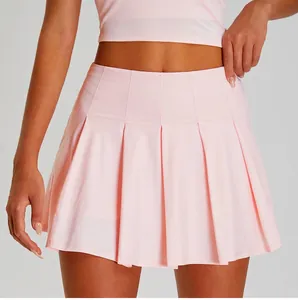 Close-up of pink pleated tennis skirt showing quick-dry fabric and athletic fit