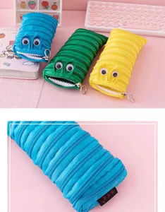 Detailed macro view of creative blue monster pencil case made from one long zipper
