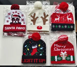 Five different Christmas knitted beanies with LED lights and colorful festive patterns