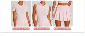 Detail view of pink pleated tennis skirt with matching short-sleeved and sleeveless polo tops