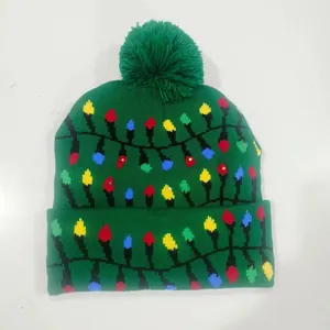 Festive green knitted Christmas beanie with glowing LED lights and colorful bulb patterns