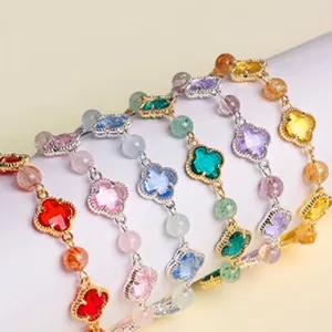 Colorful natural amethyst and pearl bead bracelets with four-leaf clover charms.