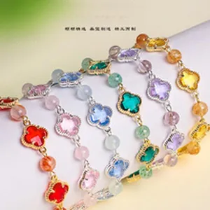 Colorful natural amethyst and pearl bead bracelets with four-leaf clover charms.