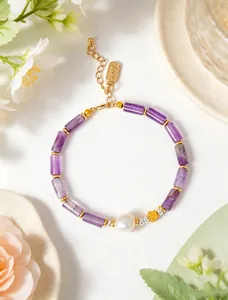 Macro detail of natural amethyst bamboo-joint bracelet featuring a single freshwater pearl