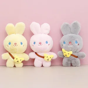 Three cute colorful plush rabbit dolls wearing mini bear shaped crossbody bags for gift