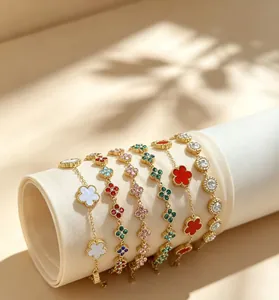 Detail of multi-colored four-leaf clover stone beaded bracelets with 18K gold plating.