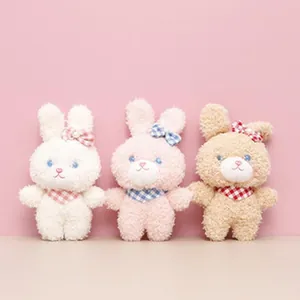 Set of three cute mini plush bunnies with checkered bows in pink, white, and brown