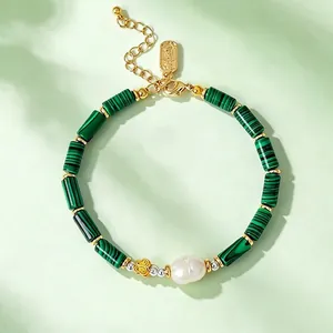 Elegant green bamboo-style beaded bracelet featuring a white freshwater pearl and gold accents.