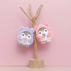 Adorable plush penguin keychains featuring lollipop and ice cream charm accessories