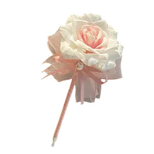 Elegant artificial rose flower ballpoint pen with pink ribbon and pearl for gift.