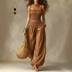 Full view of women's boho two-piece set with smocked crop top and wide-leg pants