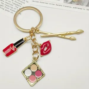 Alloy enamel makeup keychain with lipstick, lips, and eyeshadow palette charms