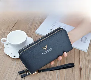 Detailed view of women's double-zipper long clutch wallet with pebble grain texture