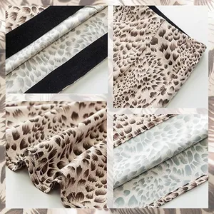 Macro detail view of the elegant leopard print satin fabric and stitching on this skirt.