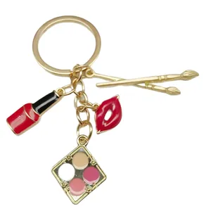 Stylish makeup themed alloy keychain featuring lipstick, lips and eyeshadow palette charms