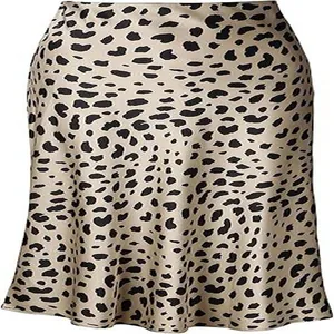 Close-up detail of elegant leopard print satin mermaid skirt with smooth fabric texture.